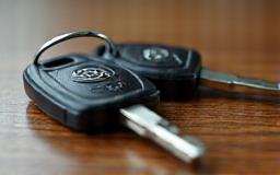 Set of car keys placed on a table.