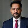 Portrait photo of Rajesh Kumar.